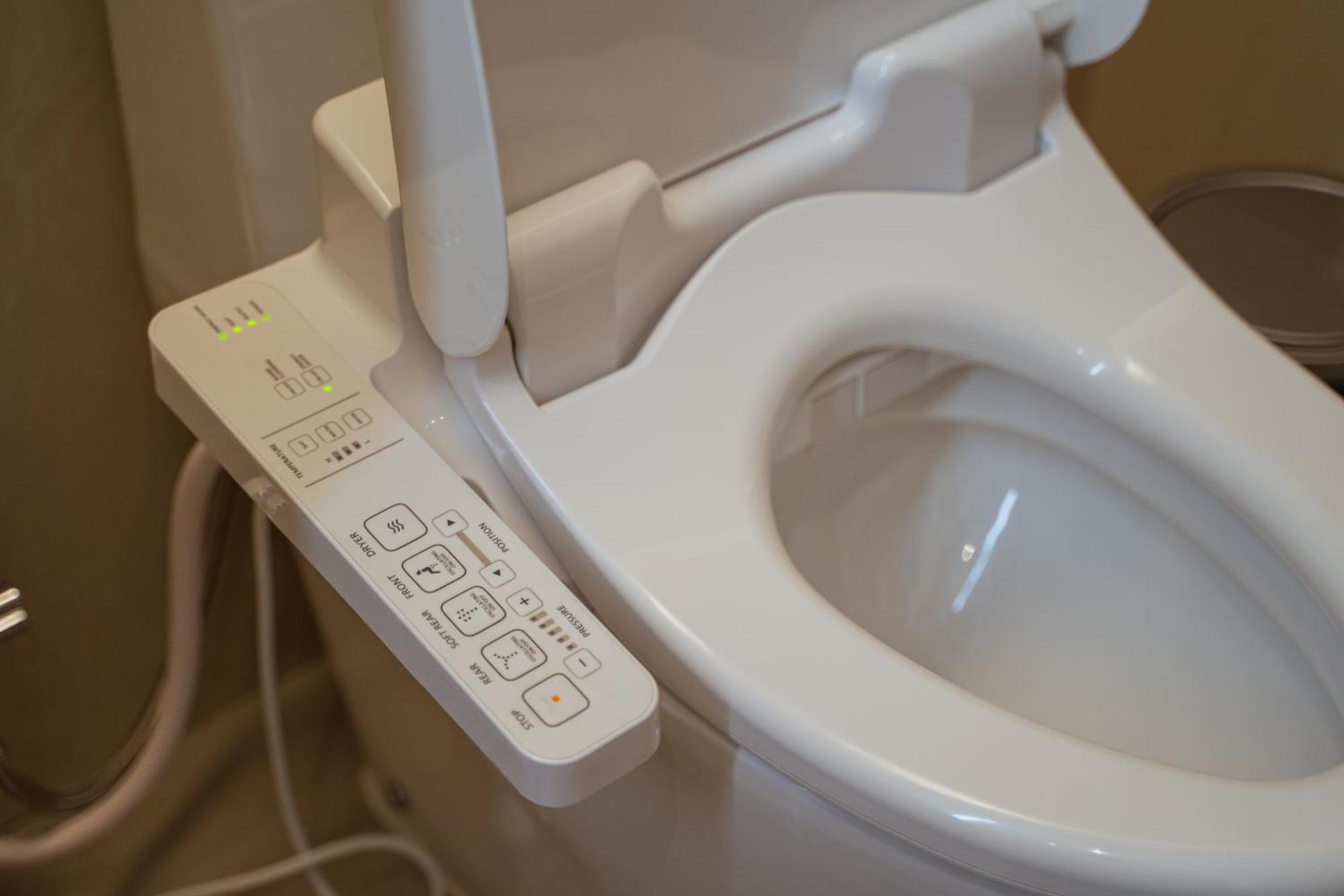Centre Point Hotel Terminal21 Korat Nakhonratchasima Εξωτερικό φωτογραφία A modern Japanese toilet with bidet and heated seat